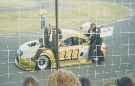 Seef Fourie tries hard not to burn his feet aboard Wikus Cronje's TT at Richards Bay 12/2001 -  After rumours of a rift between the 2 drivers - thanx Herman